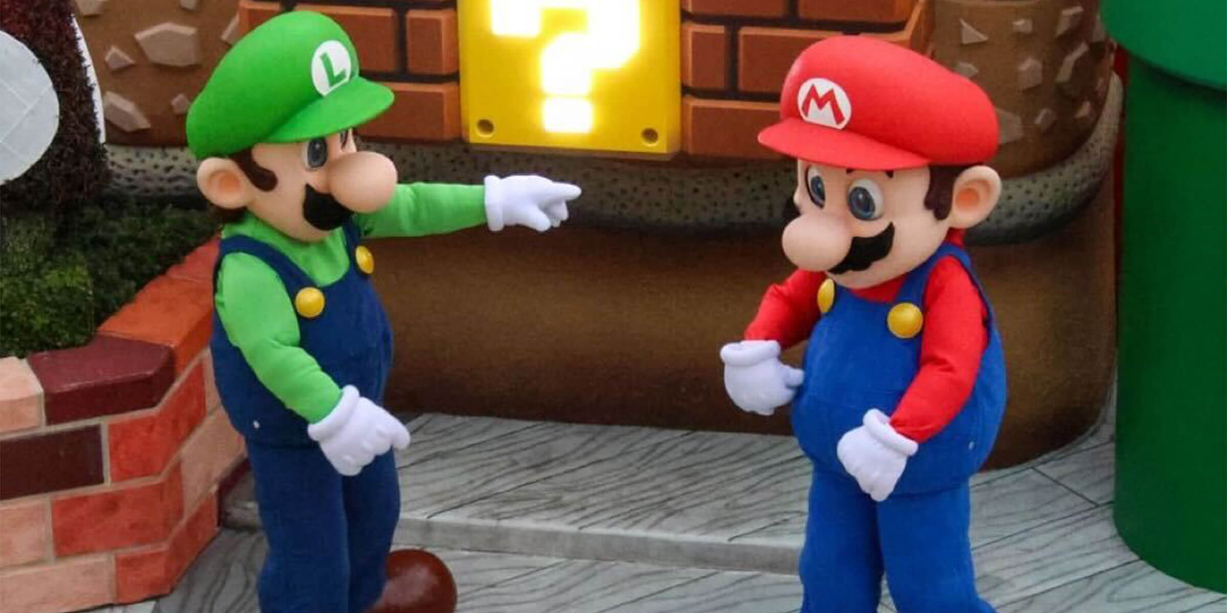 Luigi Pointing at Mario